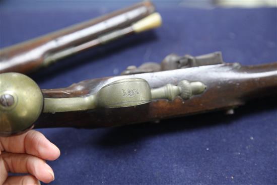 A pair of early 19th century flintlock holster pistols, signed Weston, Lewes, 15in.